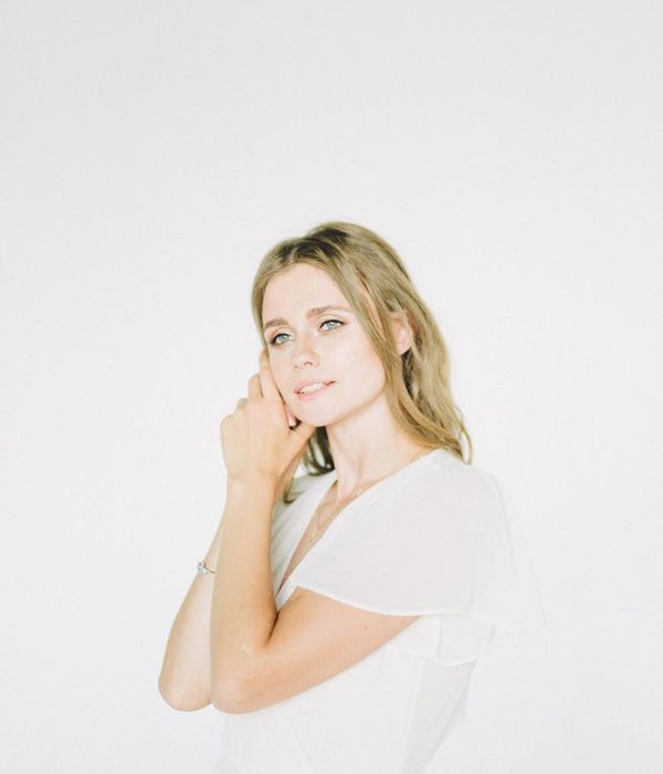 Young woman looking into distance with calm and peaceful expression